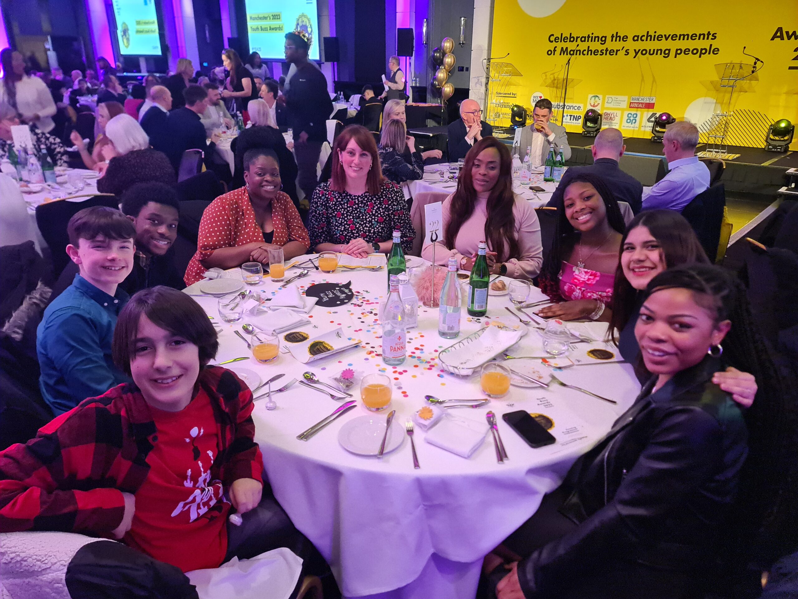 RNCM Young Artists sitting at a table at the Youth Buzz Awards