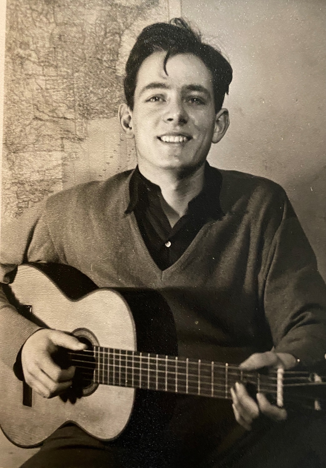 Barney Miller aged 20 playing guitar as a student at Cambridge