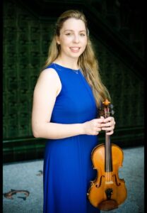 Caroline Pether in blue dress