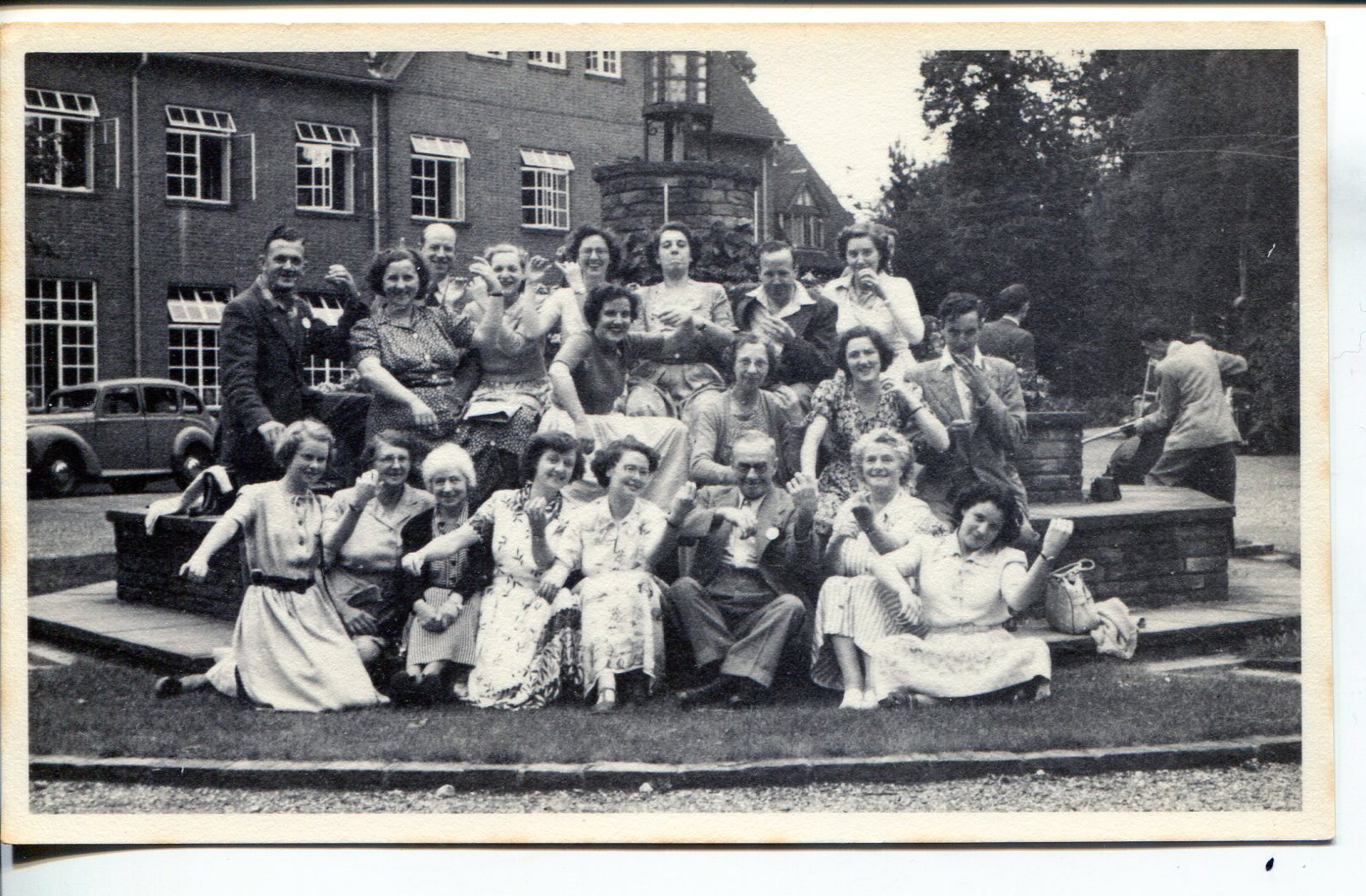 1920's NSM students sitting together outside.