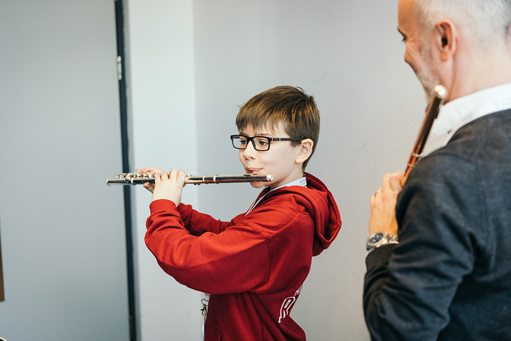 Junior RNCM flute player plays his instrument.