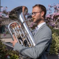 Male playing euphonium outdoors