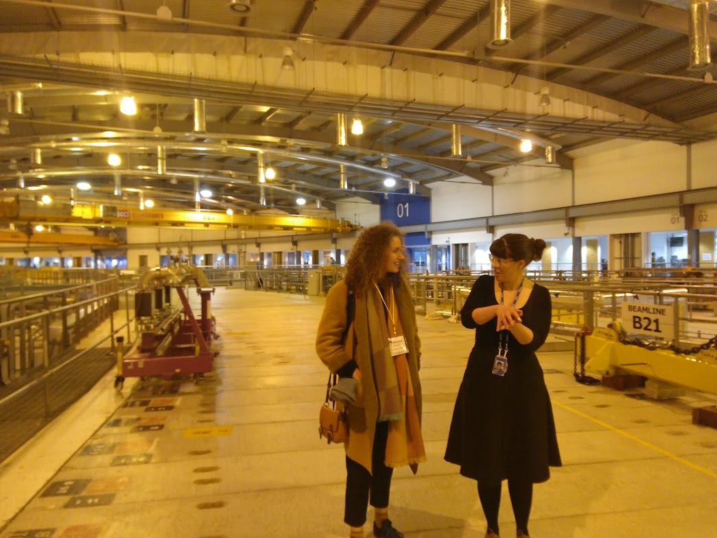 Two people touring the Diamond Light Source