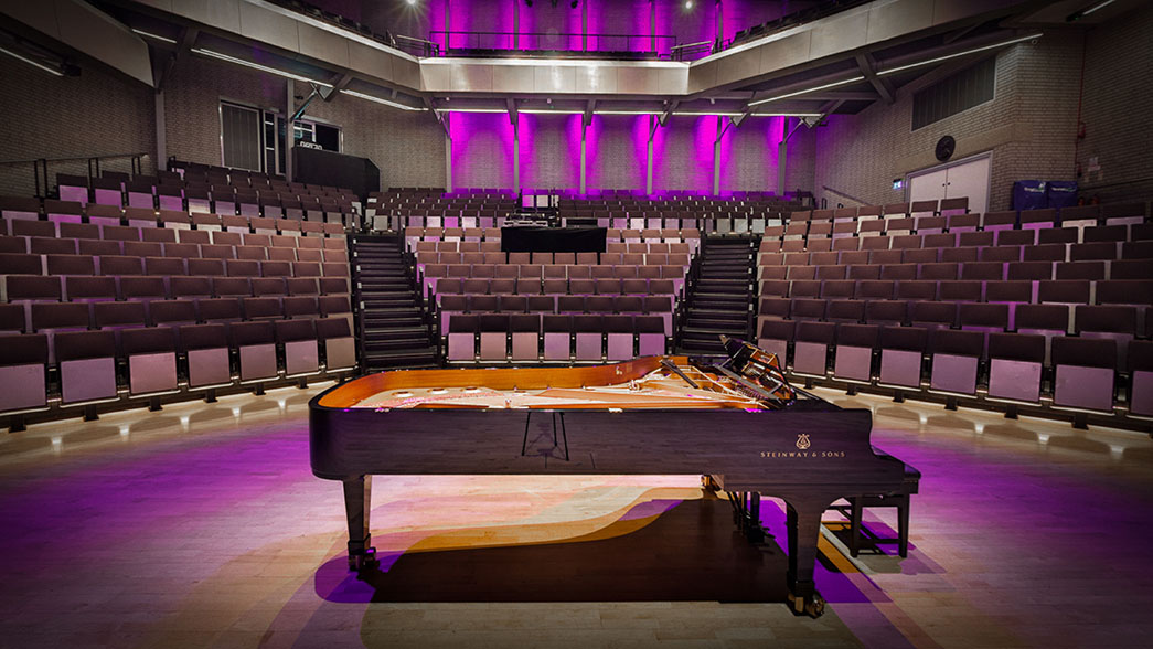 Picture of piano in concert hall