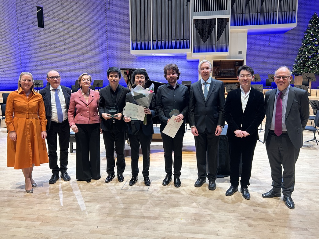 Group shot of the winners and jury members on the Concert Hall stage