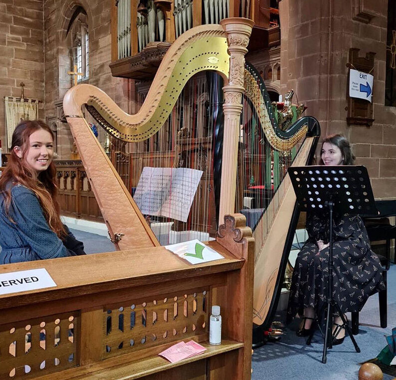 RNCM harpist Jessica Hughes performing in a church