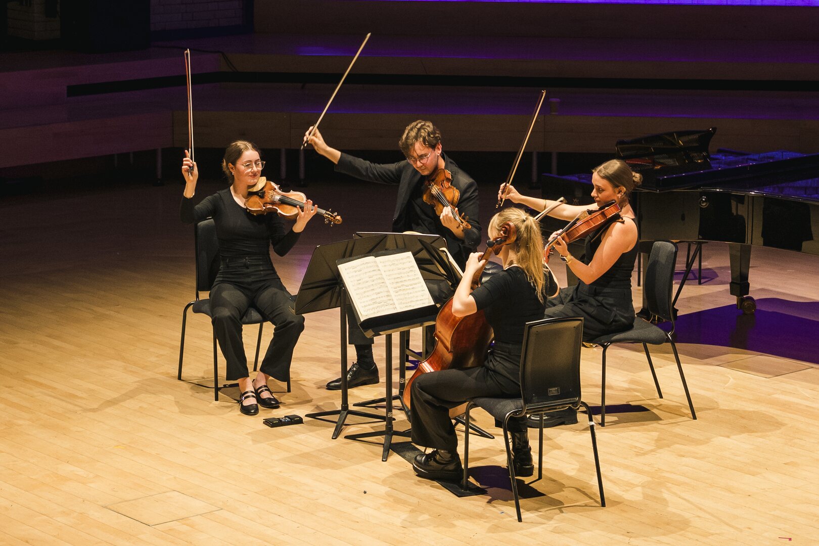 A String Quartet perform on stage