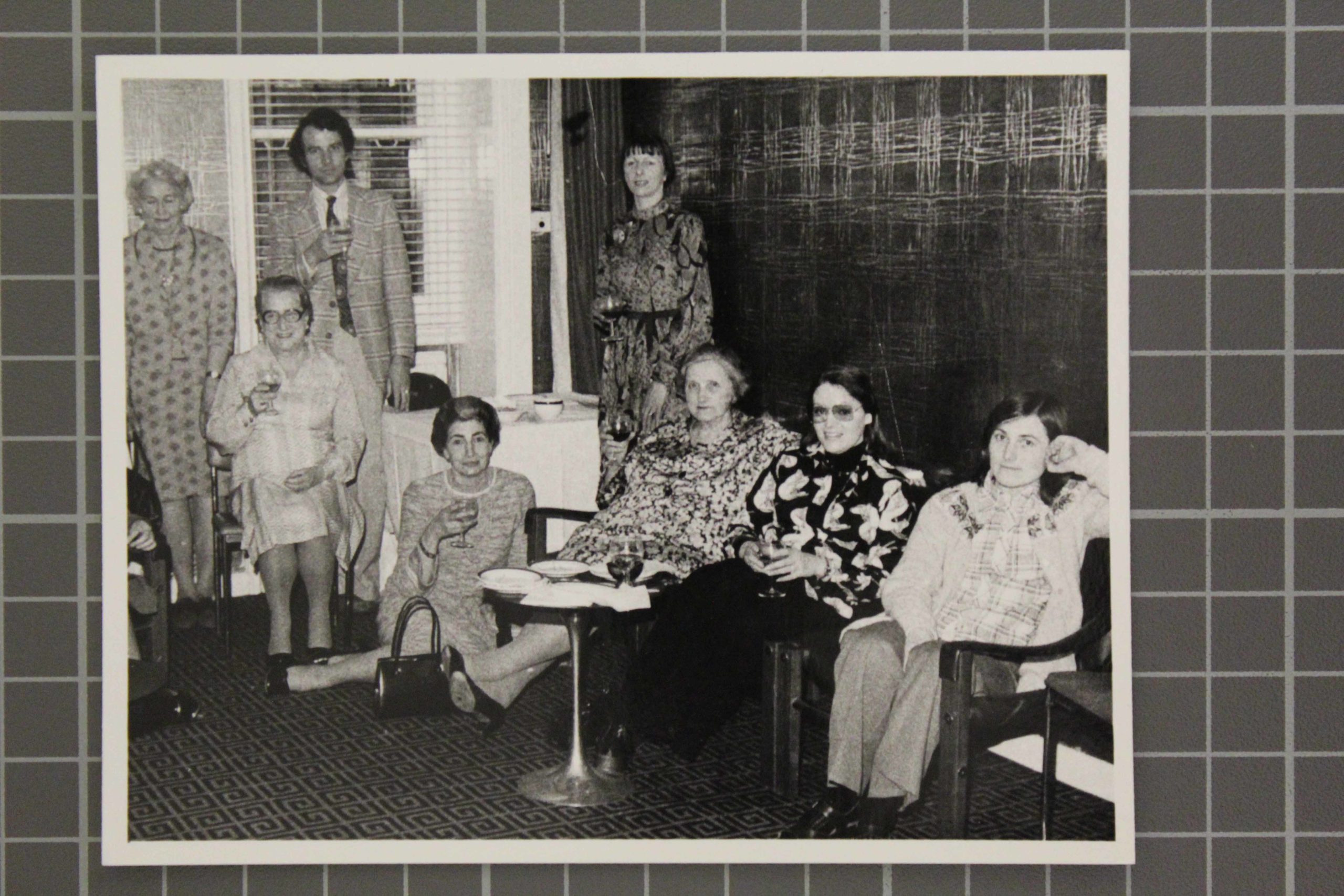 Old photograph of Ida Carroll and NSM staff sitting with drinks.