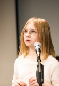 RNCM Young Artist standing by microphone