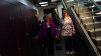 People walk through the hallways of the RNCM. 