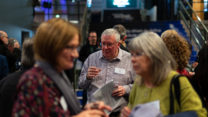 Alumni socialise on the RNCM concourse.