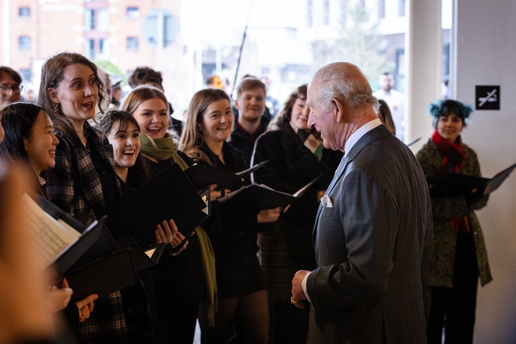 HM King Charles III chats to students from the RNCM Chamber Choi