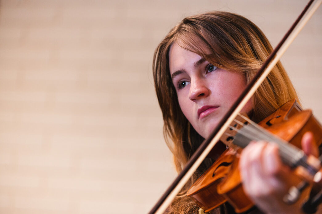 RNCM Pathfinder Student plays the violin.