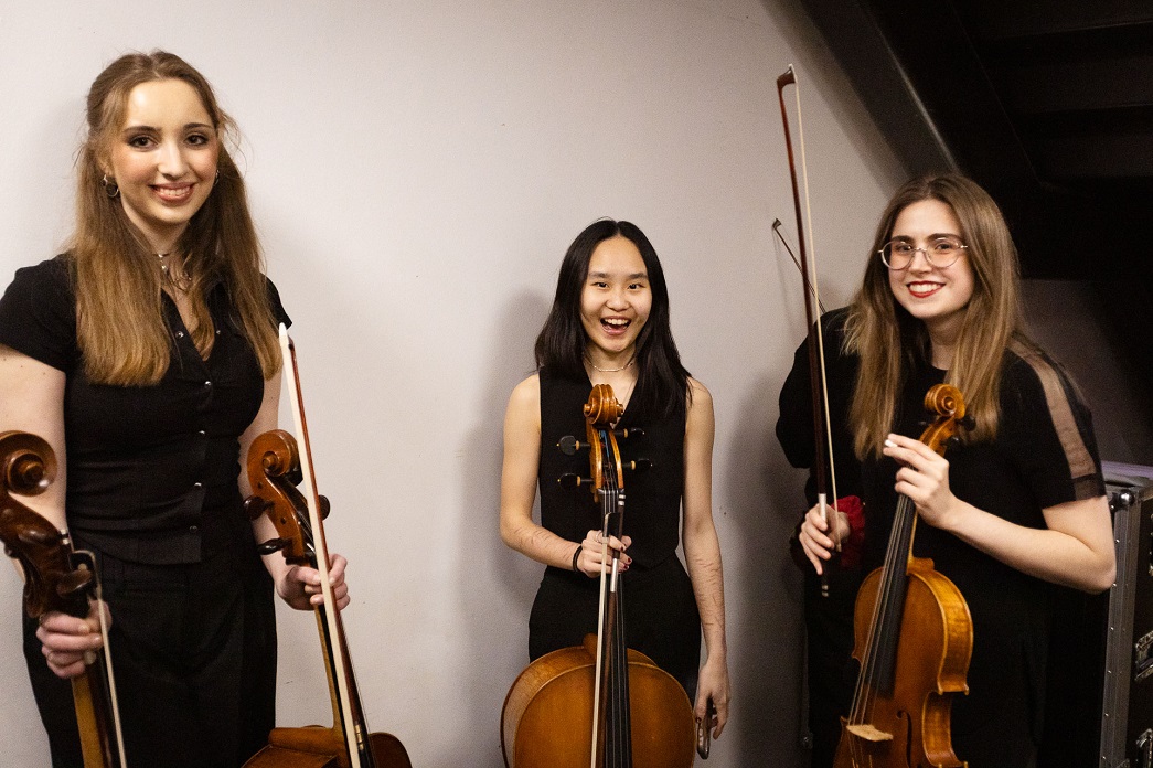 RNCM students backstage at the RNCM holding cellos
