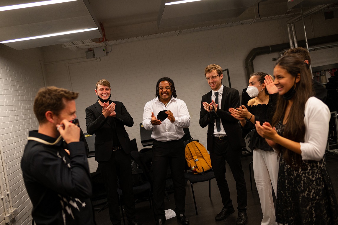 Keyboard Students laughing backstage at an RNCM Reunite event
