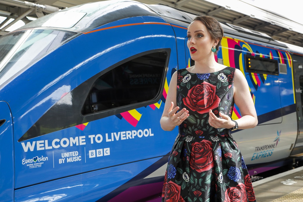 Morgan Carter singing by the TransPennine Express Eurovision train