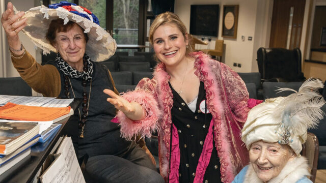 Lucy Temby with care home residents at the piano
