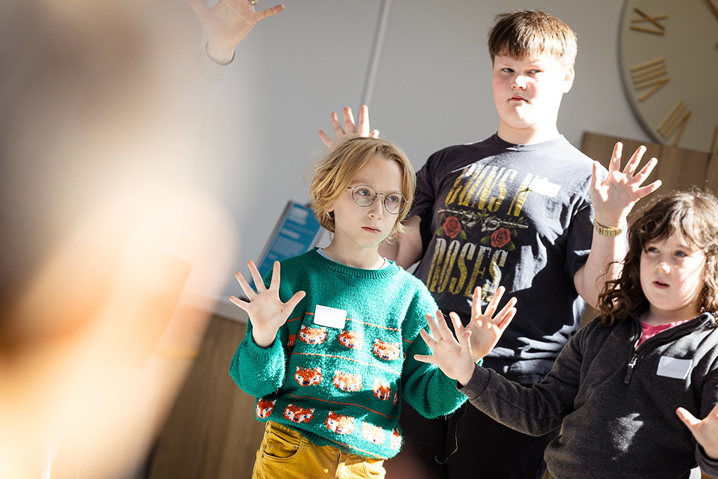 Young projects students warm up. 