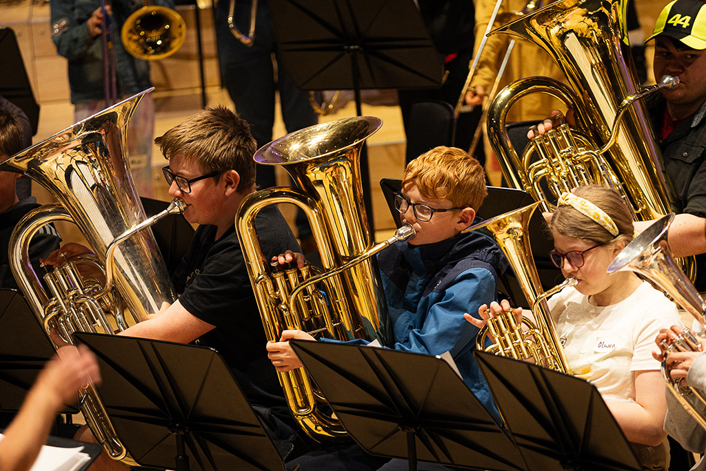 Young projects students play tubas. 