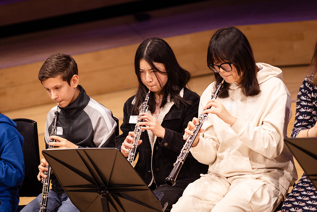 Young projects students play oboe. 