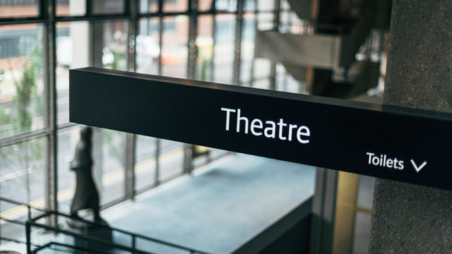 A sign directing people to the RNCM theatre. 