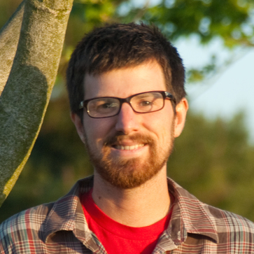 Headshot of a man in glasses