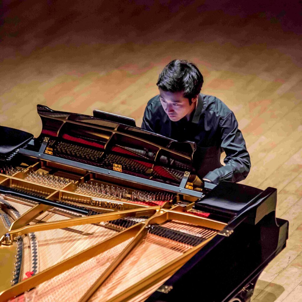 Student playing solo piano